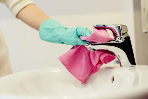 Carpet cleaning technician preparing equipment for a scheduled service